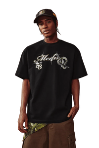 MEDM SS25 Snake Year Limited Edition Tee in black with striking graphic design