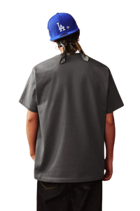 Back view of the MEDM SS25 Snake Year Limited Edition Tee in gray, worn by a model with a blue cap
