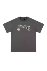 MEDM SS25 Snake Year Limited Edition Tee in dark grey with unique graphic design and relaxed fit