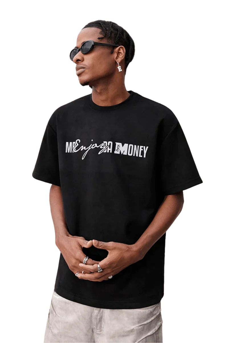 Model wearing a black MEDM SS25 Suede Print Tee with a relaxed fit and stylish design