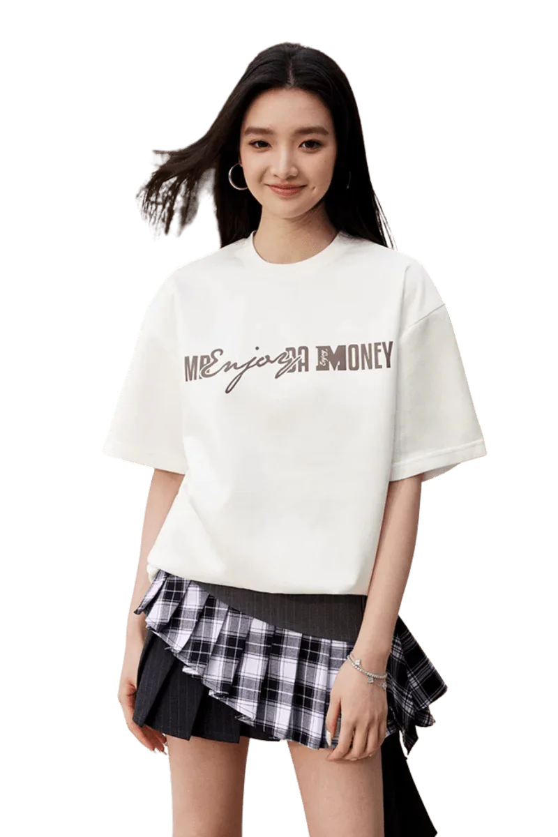 Model wearing the MEDM SS25 Suede Print Tee in white with a stylish layered skirt