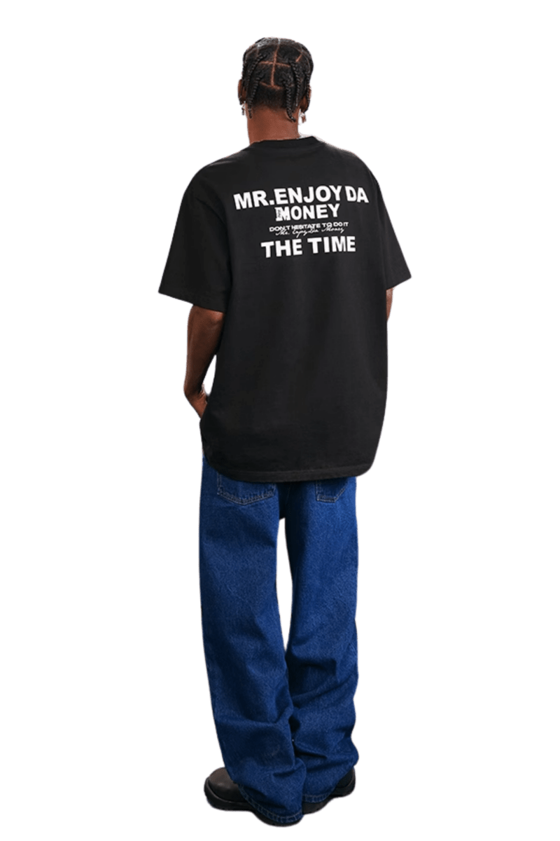 Men's MEDM SS25 The Time Basic Logo Tee in black with bold lettering on the back
