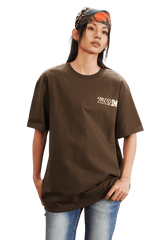 Model wearing the MEDM SS25 The Time Basic Logo Tee in brown for a stylish casual look