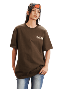 Model wearing the MEDM SS25 The Time Basic Logo Tee in brown for a stylish casual look