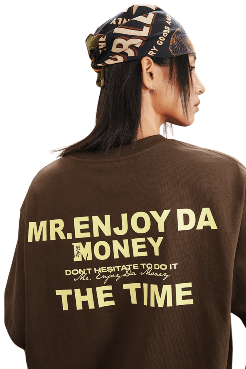 MEDM SS25 The Time Basic Logo Tee in brown featuring large logo print on the back