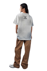 MEDM SS25 Washed Angel Butterfly Tee displayed on a model with a relaxed fit and unique back design