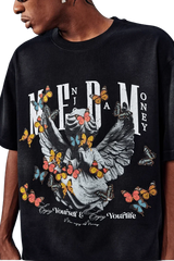 MEDM SS25 Washed Angel Butterfly Tee featuring a graphic design with butterflies on a black background