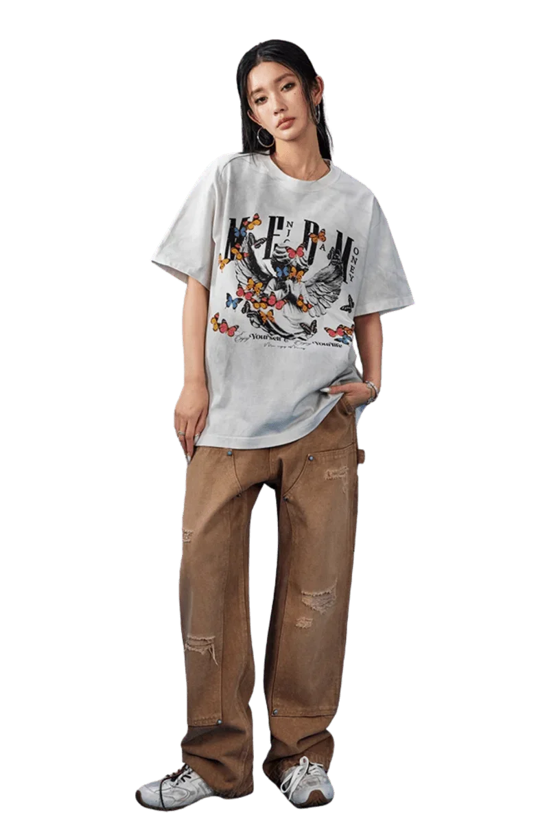 Model wearing MEDM SS25 Washed Angel Butterfly Tee with butterfly graphic and relaxed fit