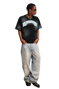 Man wearing MEDM SS25 Washed Arch Logo Tee with relaxed fit and casual style for everyday wear
