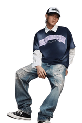 Model wearing MEDM SS25 Washed Arch Logo Tee paired with distressed jeans and cap
