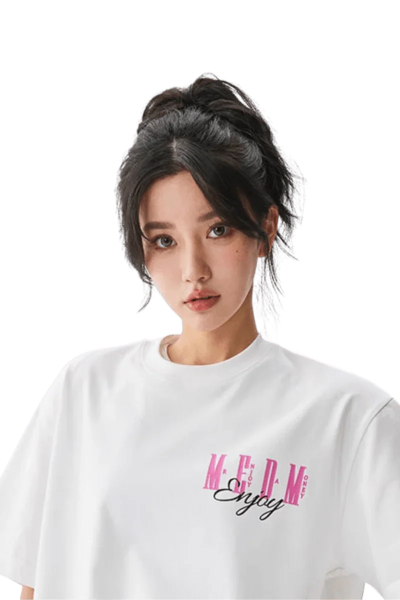 Model wearing a white MEDM Three Colour Print Tee with stylish logo design for casual fashion