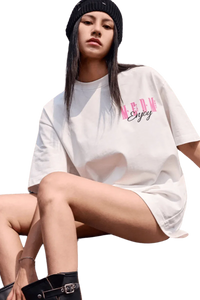 Model wearing a MEDM Three Colour Print Tee in white with stylish oversized fit and logo design