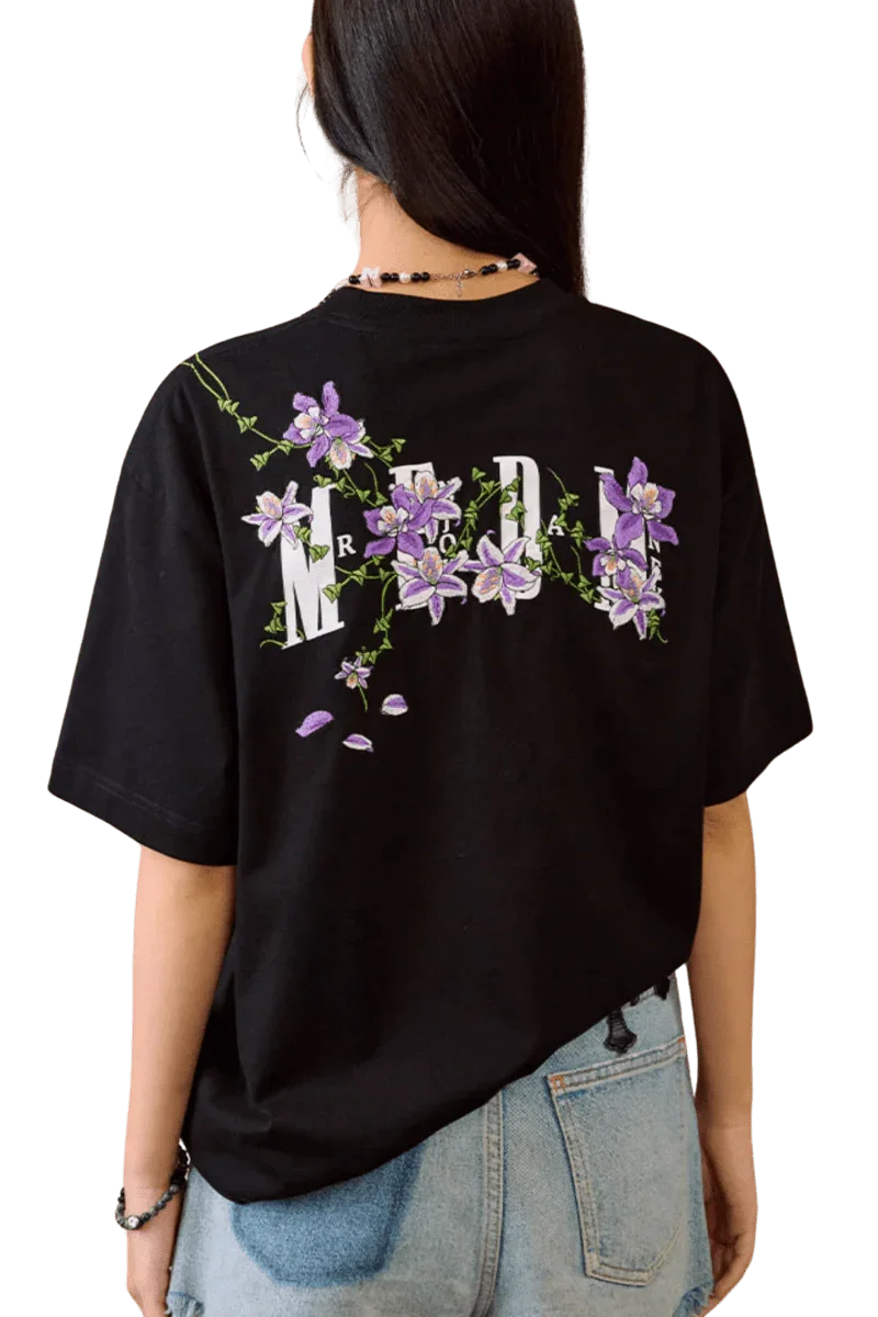 MEDM Vine Flower Embroidery Tee in black with vibrant floral design on the back