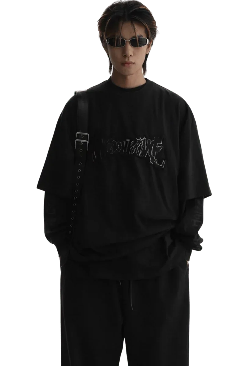Masonprince Vintage Patch Tee in black worn by male model with sunglasses and layered sleeves