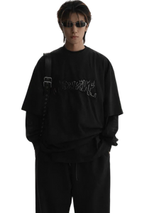 Masonprince Vintage Patch Tee in black worn by male model with sunglasses and layered sleeves