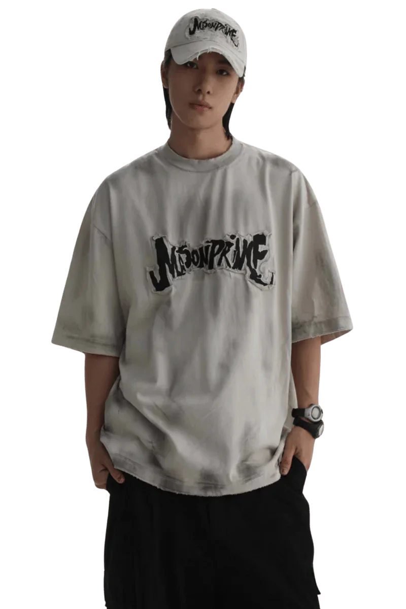 Masonprince Vintage Patch Tee in light gray with black logo print worn by model with cap and watch