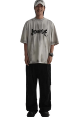 Masonprince Vintage Patch Tee worn by a smiling model with black pants and a white cap
