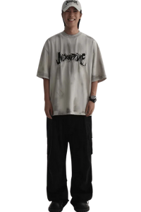 Masonprince Vintage Patch Tee worn by a smiling model with black pants and a white cap