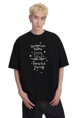 Dangerous People Peaceful Living Hand Painted Tee in black featuring a unique graphic design