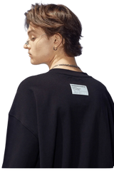Back view of a Dangerous People black t-shirt featuring reflective wording t-shirt style