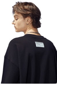 Back view of a Dangerous People black t-shirt featuring reflective wording t-shirt style