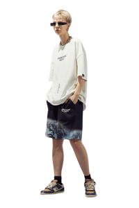 Trendy Dangerous People reflective wording t-shirt paired with stylish shorts for a modern streetwear look