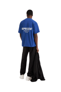 Back view ofRepresent Owners Club T-Shirt in blue worn by a model with relaxed fit
