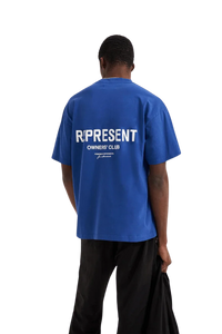 Blue Represent Owners Club T-Shirt featuring a bold logo on the back for a stylish streetwear look
