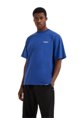 Model wearing blue Represent Owners Club T-Shirt with a relaxed fit and casual style