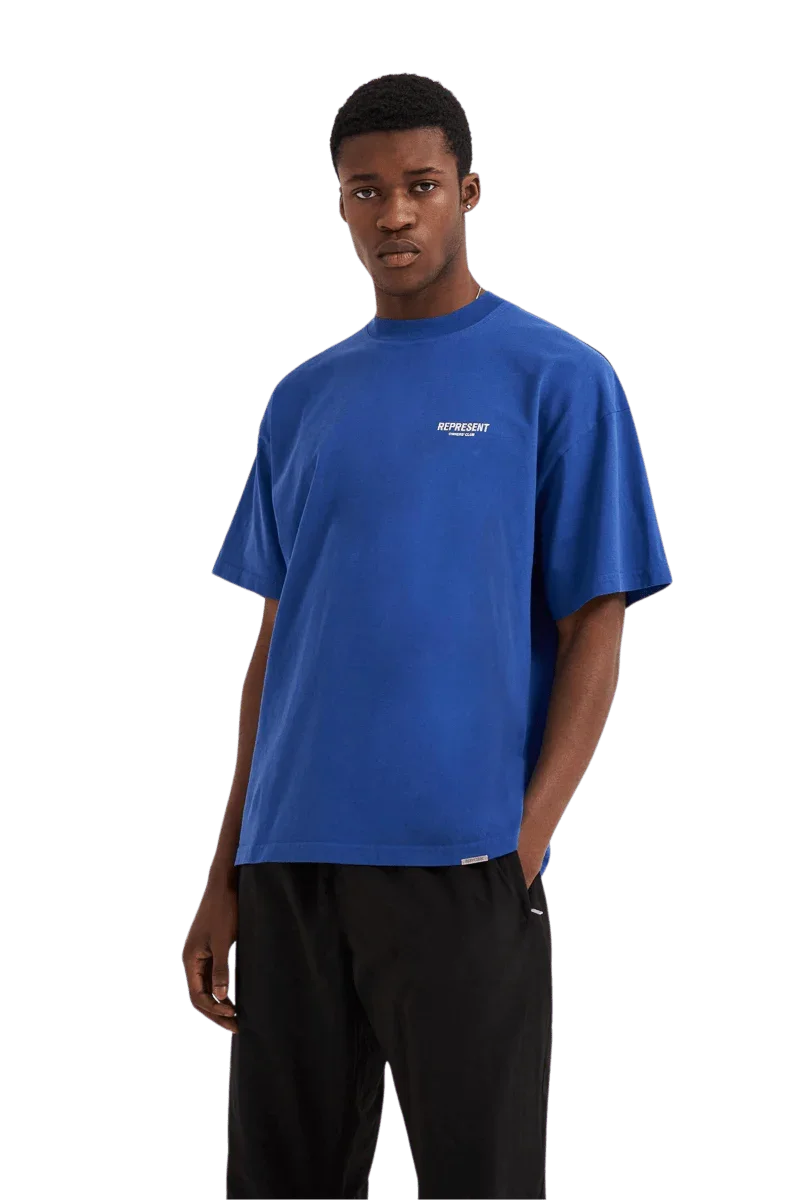 Model wearing blue Represent Owners Club T-Shirt with a relaxed fit and casual style