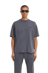 Representation of SS24 Owners Club Rubber Logo T-Shirt in gray on a model for casual fashion look