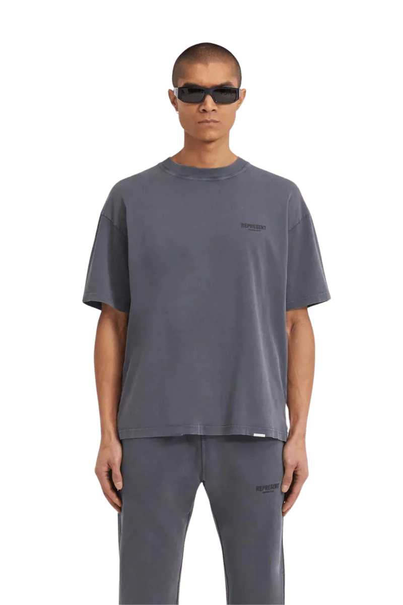 Representation of SS24 Owners Club Rubber Logo T-Shirt in gray on a model for casual fashion look