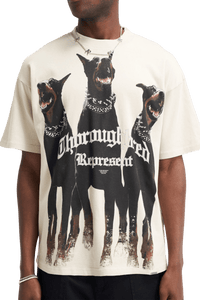 Represent Thoroughbred Tee featuring graphic of three Doberman dogs in bold design on a cream background