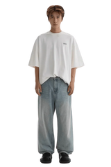 Masonprince Small Logo Basic Tee in white worn with loose blue jeans and black shoes