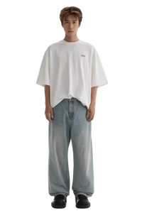 Masonprince Small Logo Basic Tee in white worn with loose blue jeans and black shoes