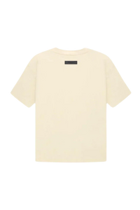 Fear Of God Essentials FW22 Flock Logo Tee in cream with a minimalist design for casual wear