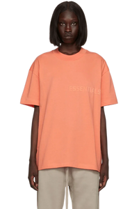Fear Of God Essentials FW22 Flock Logo Tee in coral with relaxed fit and subtle branding