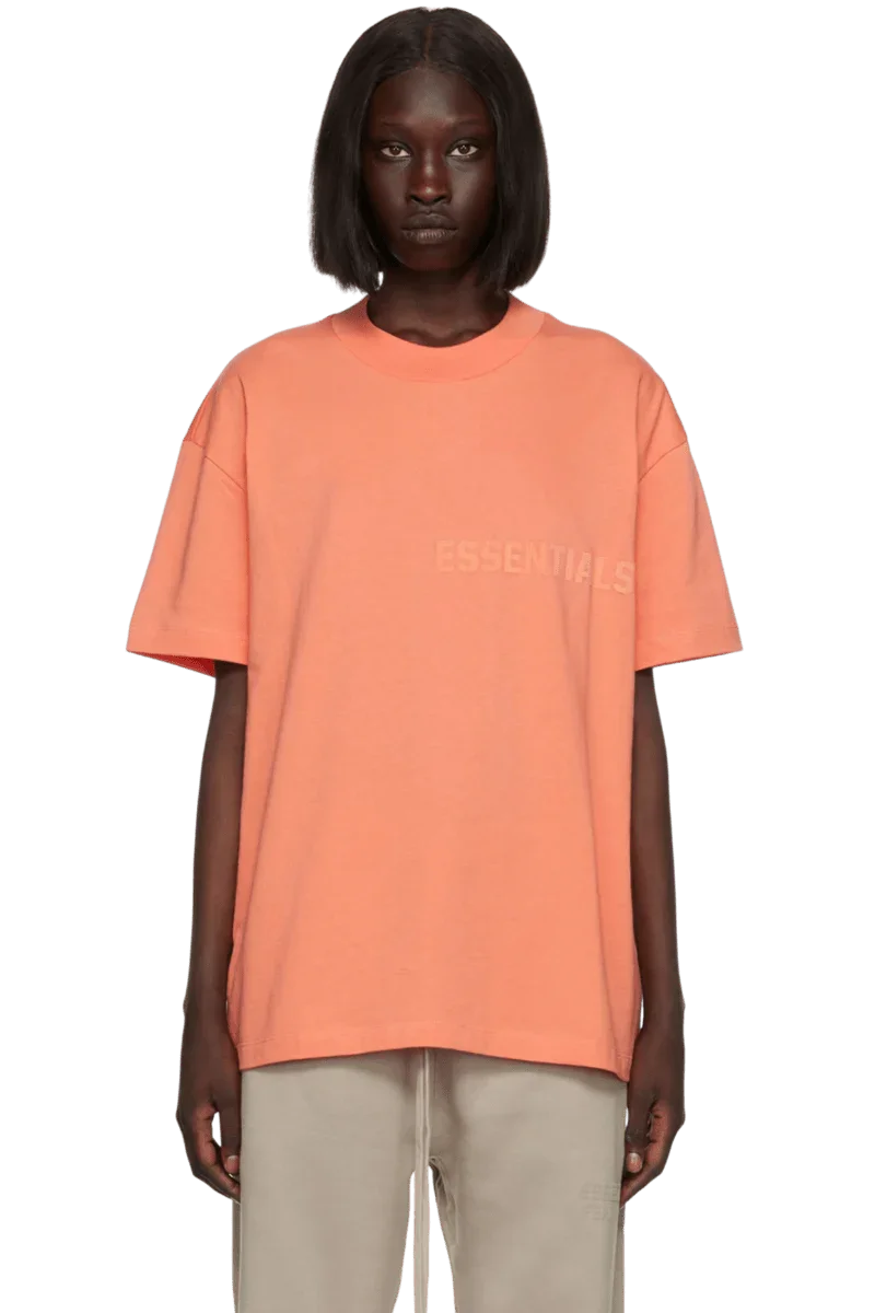 Fear Of God Essentials FW22 Flock Logo Tee in coral with relaxed fit and subtle branding