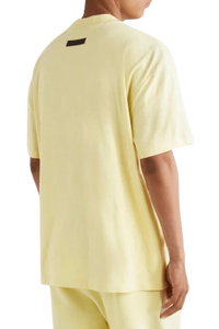 Fear Of God Essentials FW22 Flock Logo Tee in soft yellow with a relaxed fit and stylish back detail