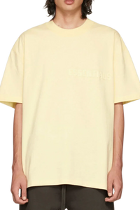 Fear Of God Essentials FW22 Flock Logo Tee in light yellow with relaxed fit for casual style