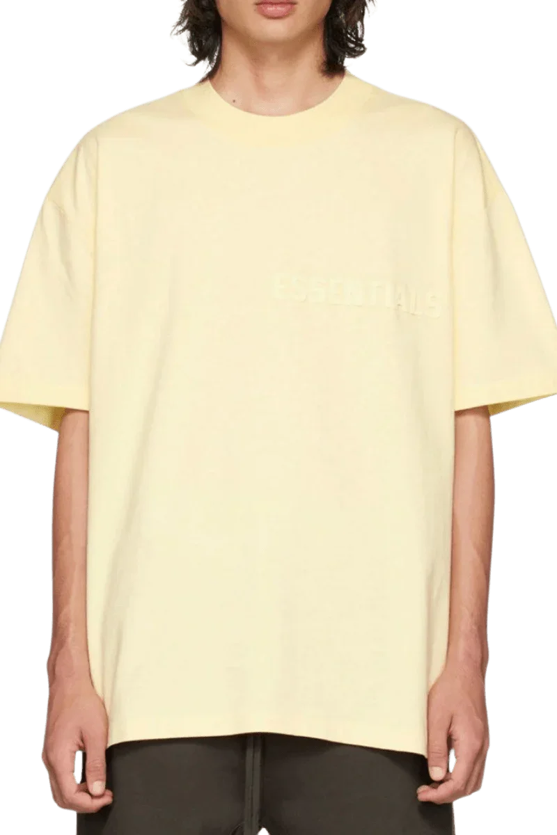 Fear Of God Essentials FW22 Flock Logo Tee in light yellow with relaxed fit for casual style