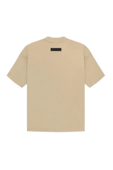 Fear Of God Essentials SS23 Rubber Embossed Tee in Beige with minimalist design on a black background