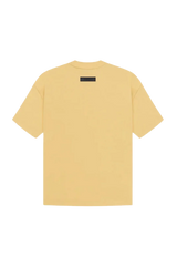 Fear Of God Essentials SS23 Rubber Embossed Tee in soft yellow with a minimalist design