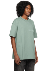 Fear Of God Essentials SS23 Rubber Embossed Tee in light green for a casual and stylish look