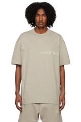 Fear Of God Essentials SS23 Rubber Embossed Tee in beige featuring a relaxed fit and logo detail