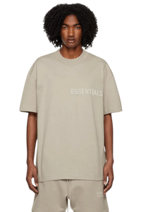 Fear Of God Essentials SS23 Rubber Embossed Tee in beige featuring a relaxed fit and logo detail