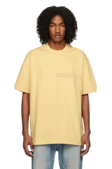 Fear Of God Essentials SS23 Rubber Embossed Tee in Soft Yellow for a Casual Look